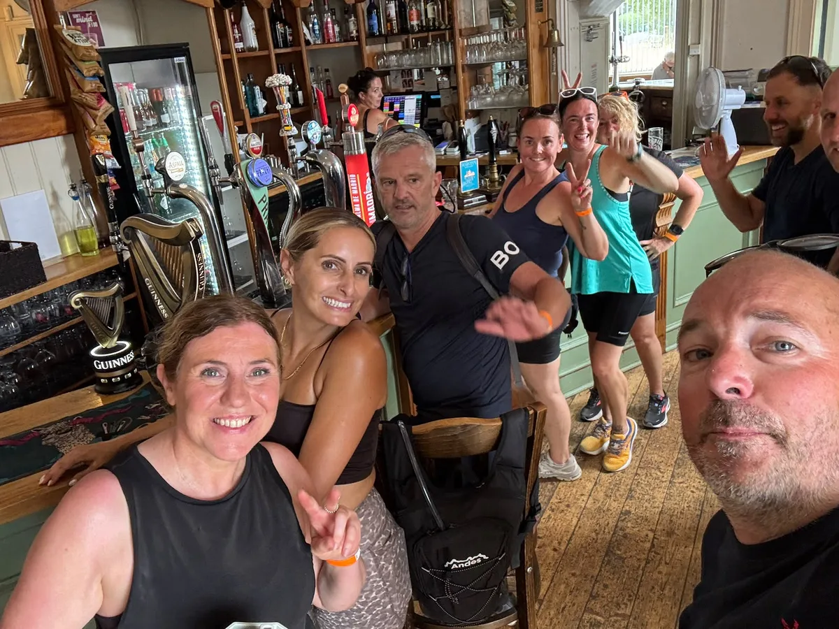 Pedals and Pints riders at the bar during a pub stop on the first ride